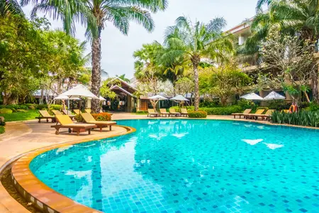 Residential swimming pool in Dubai villa with crystal clear water and landscaping